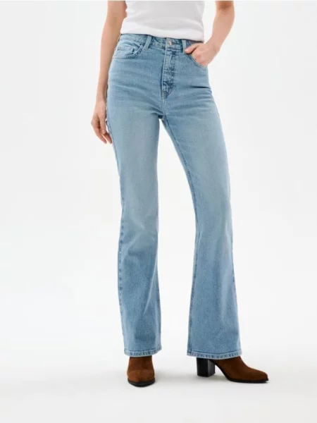 Розкльошені джинси з ефектом прання синій