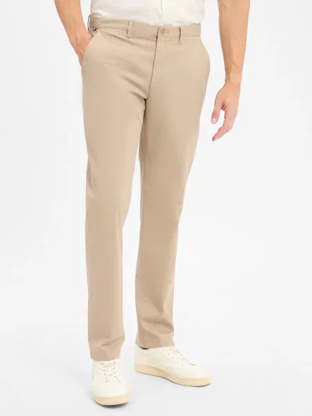 Chinosy o kroju regular fit z mieszanki bawełny model ‘DENTON’ Tommy Hilfiger beżowe