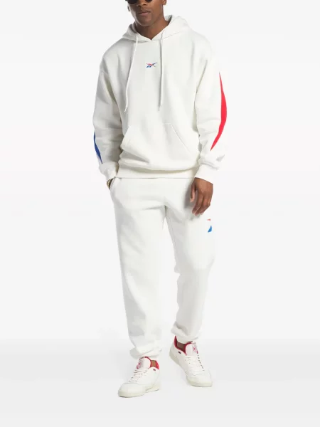 Běžecké kalhoty Reebok s autogramem
