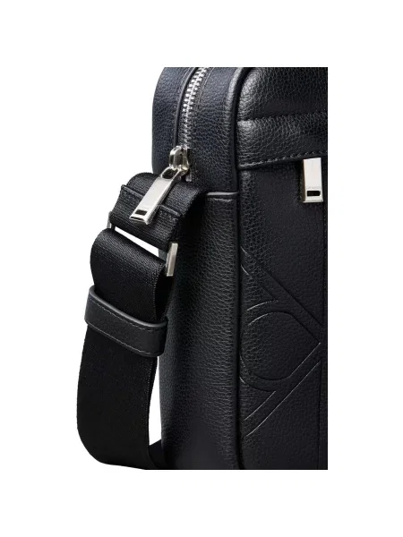 Calvin Klein Ľadvinka Emblem Aop Emboss Reporter čierna