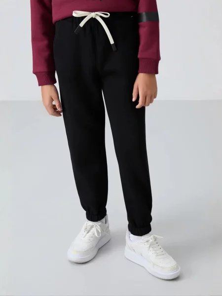 Tommy Life Kalhoty TOMMY Kinder Jogginghose' černá