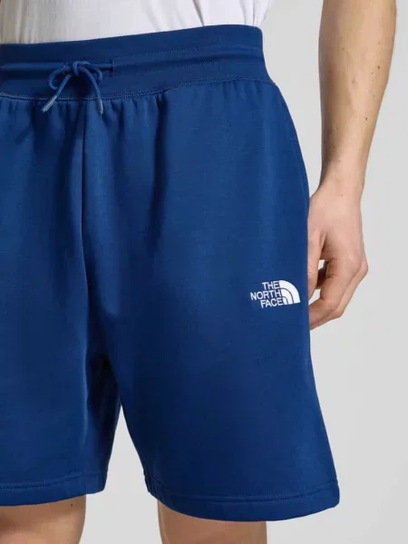 Szorty z dzianiny dresowej o kroju relaxed fit z wyhaftowanym logo The North Face granatowe
