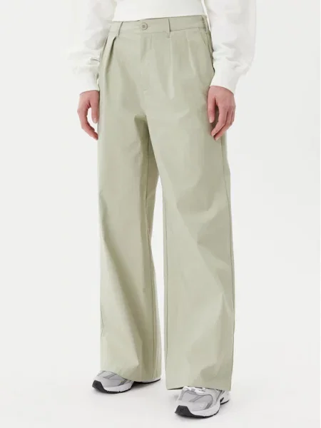 Hlače iz tkanine New Balance zelena