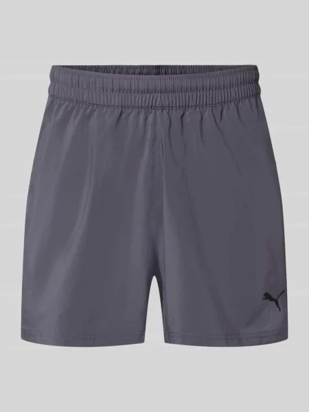 Szorty sportowe o kroju regular fit z nadrukiem z logo model „TAD ESSENTIALS” Puma Performance