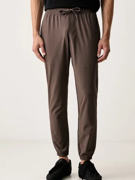 Under Armour pantaloni de trening pentru bărbați Vibe Woven maro