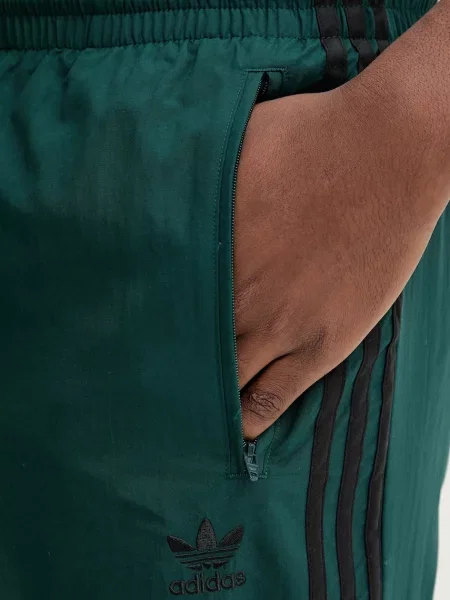 Спортивні штани adidas Originals Firebird Pants з аплікацією зелений