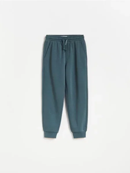 Reserved Pantaloni de jogging din metalizat albastru