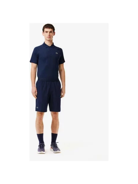 Spodenki rowerowe Lacoste Sportsuit Ultra-Dry regular granatowe XS niebieskie