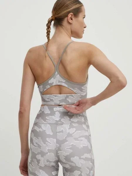 Sportovní podprsenka Reebok ID Train béžová