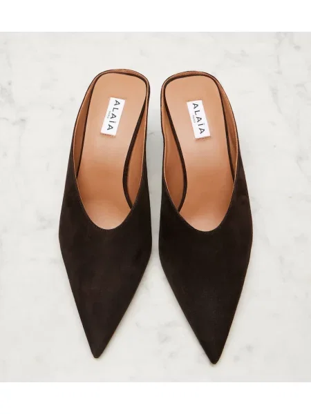 Papuci tip mules Alaïa din piele de căprioară cu pană negru