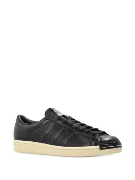 Trčanje natikače Adidas s vezom s paisley uzorkom crna
