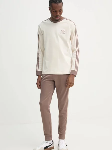 Спортивні штани adidas Originals SST TP з аплікацією бежевий