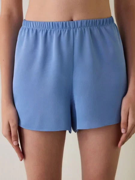 Penti Pyžamové kalhoty PENTI Luna Spitzen-Satinhose azurová