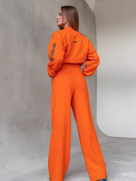 Женский костюм с брюками палаццо помаранчеві