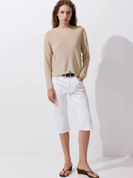 Sweter z dzianiny z lureksową nitką złoty Kobieta MANGO