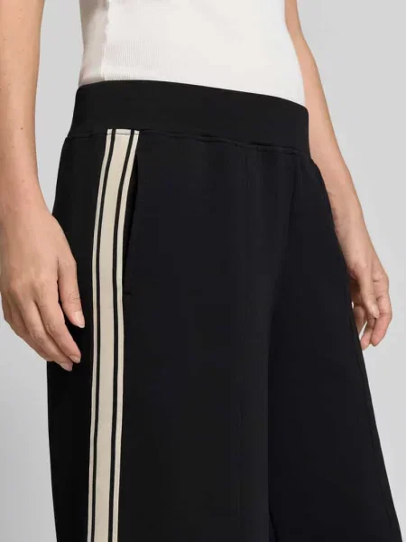 Spodnie dresowe o kroju relaxed fit z mieszanki bawełny Fabletics czarne