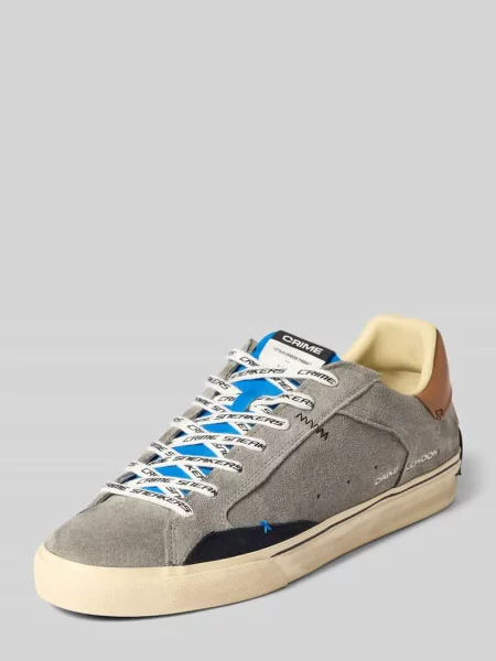 Sneakersy z detalami z logo marki Crime London