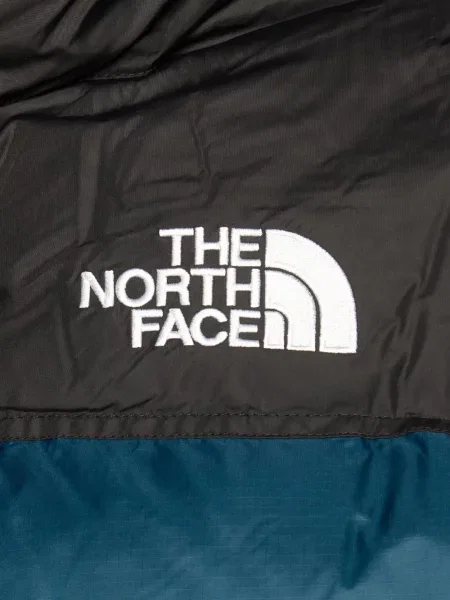 Kurtka The North Face z kapturem niebieska