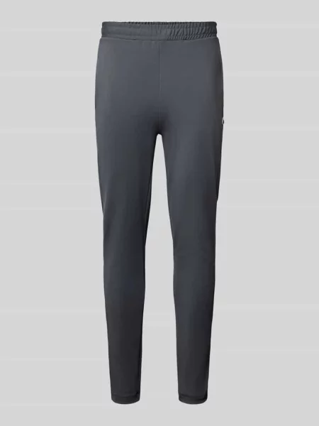 Spodnie dresowe o kroju slim fit z naszywką z logo Lacoste Sport