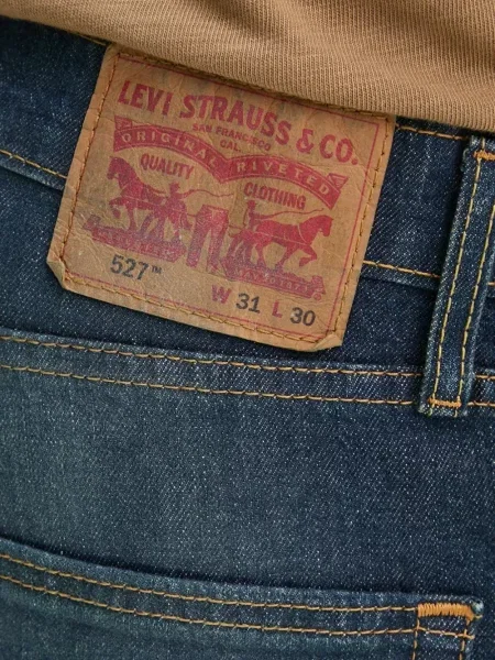 Kožne prugaste traperice Levi's® plava