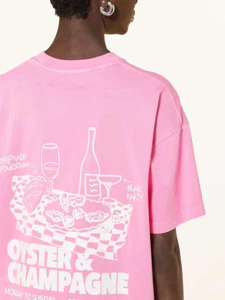 Oversize’owy T-shirt z nadrukiem logo Another Cotton Lab różowa