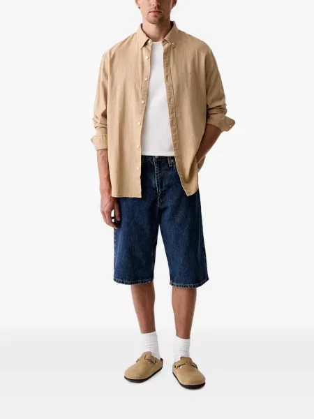 Decupat pantaloni scurți din denim Levi's® zdrențuiți cu talie înaltă albastru