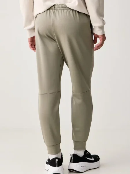 Nike spodnie treningowe Flex Therma-FIT zielone