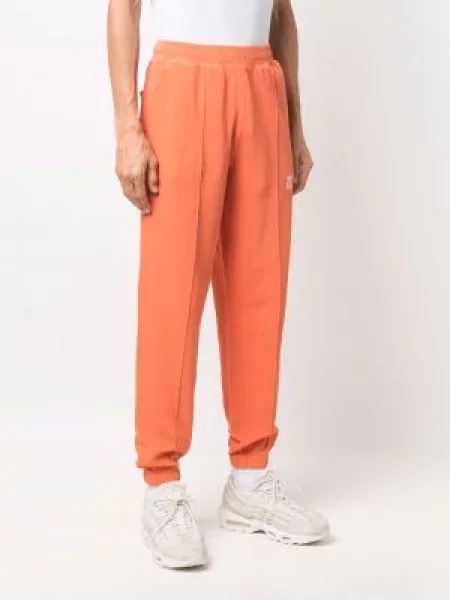 Zúžené kalhoty jogger Helmut Lang s potiskem oranžové