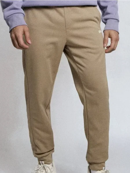 Sinsay Spodnie dresowe jogger beżowy