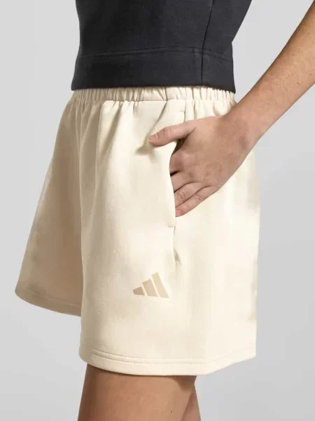 Szorty dresowe z elastycznym pasem Adidas Sportswear beżowe