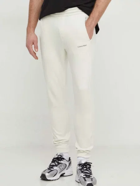 Calvin Klein spodnie dresowe beżowy gładkie