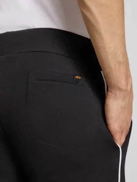 Spodnie dresowe z logo Alpha Industries czarny