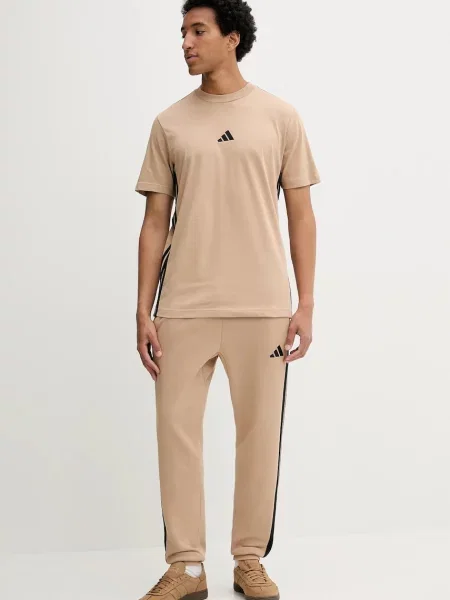 Спортивні штани adidas Essentials з аплікацією бежевий