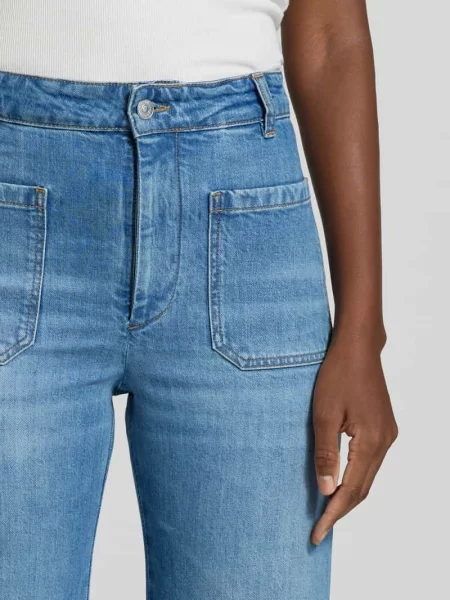 Jeansy o kroju wide fit z mieszanki bawełny Victoria Beckham niebieskie
