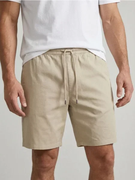 Sinsay Koupací šortky s nápisem béžová