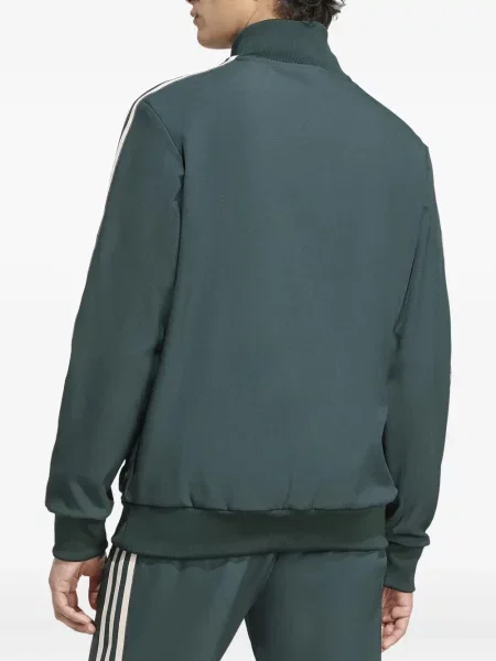 Pruhované kalhoty Adidas s výšivkou na platformě černé