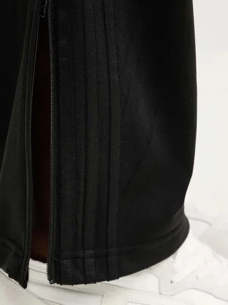 Спортивні штани adidas Originals Firebird з аплікацією чорний