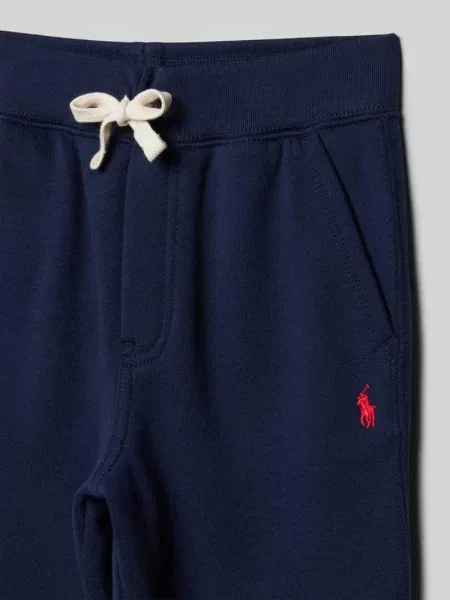 Spodnie dresowe w kroju regular fit z wpuszczanymi Polo Ralph Lauren granatowe