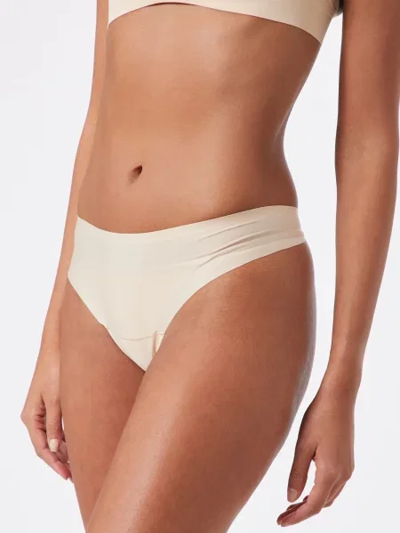 MAGIC Bodyfashion Tangá Dream Invisibles Thong krémová