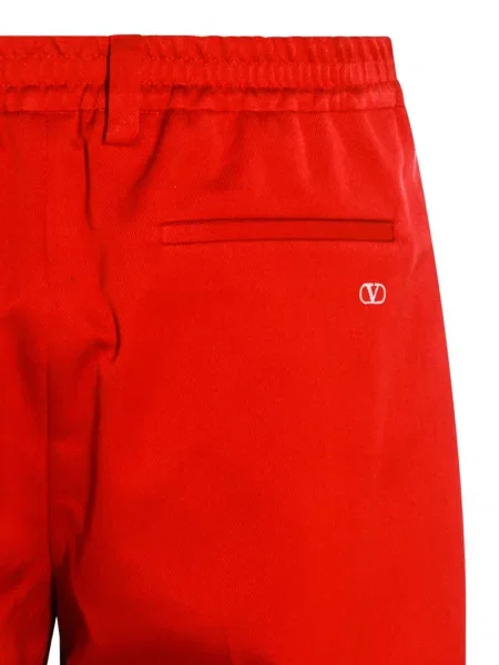 Pantaloni Valentino Garavani plisate roșu