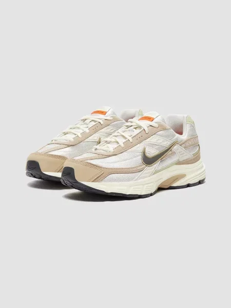 Кожаные кроссовки Nike бежевые