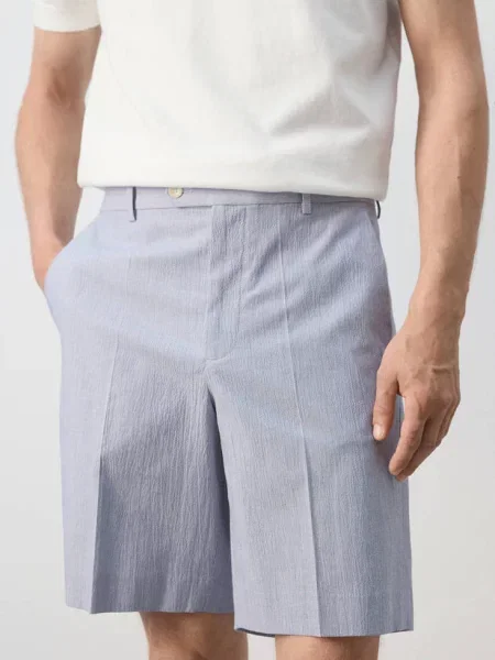 Bermudy slim fit z mieszanki bawełny Mężczyzna 46 MANGO MAN błękitny