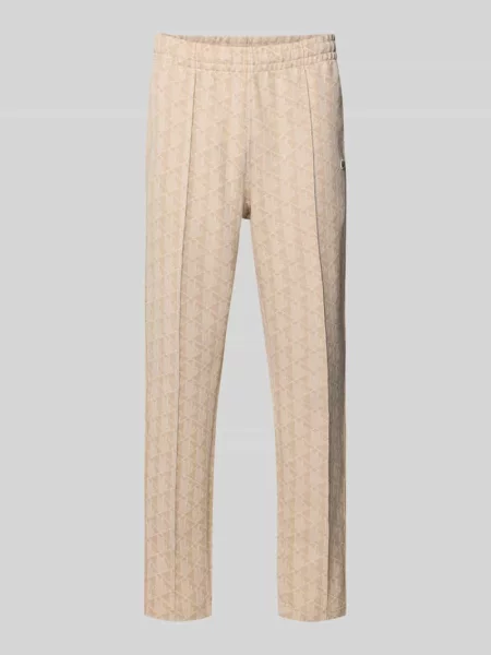 Spodnie dresowe o kroju regular fit z dodatkiem bawełny Lacoste białe