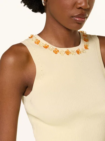 Dzianinowy top Claudie Pierlot z falbankami biały