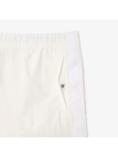 Lacoste Spodnie Dresowe Relaxed Fit beżowy