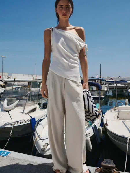 Lejące spodnie wide leg z zakładkami Teen XS MANGO TEEN beżowy