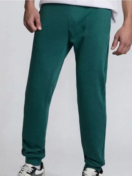 Sinsay Spodnie jogger slim fit ciemny turkus