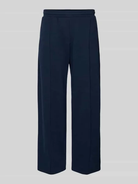 Spodnie dresowe z zaszewką i emblematem w stylu college Review granatowe