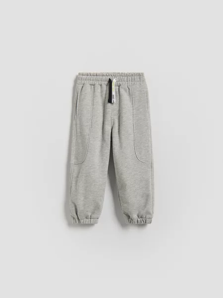 Reserved kalhoty joggers světle šedá