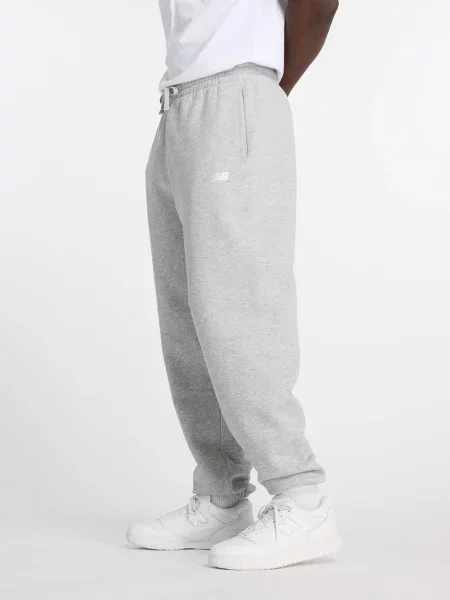 Спортивні штани New Balance SPORT ESSENTIALS FLEECE бавовна/поліестер сірий